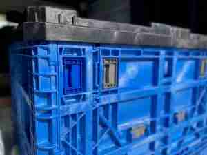 close up of blue storage delivery crate