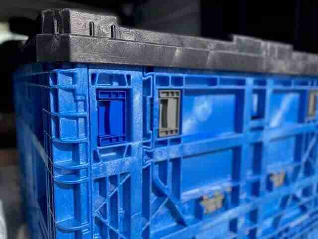 close up of blue storage delivery crate