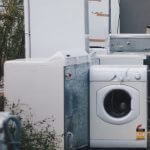 old washer and dryer sitting outside