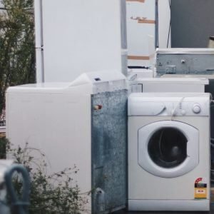 old washer and dryer sitting outside